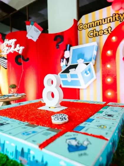 The cake for this party was a detailed, edible Monopoly board, complete with a "Community Chest" and other iconic game elements. It was a showstopper that tasted as good as it looked.