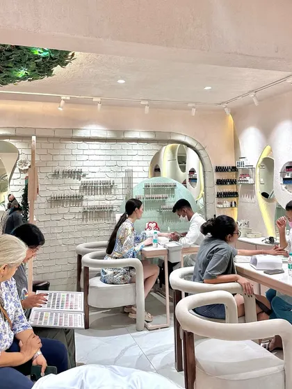 Another angle of the studio in action. You can see clients consulting with our technicians and enjoying their services in our comfortable, custom-designed chairs. It's all part of the Bellissimo experience.