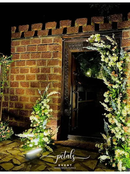 A duplicate image of the stunning broken arch entrance at night.