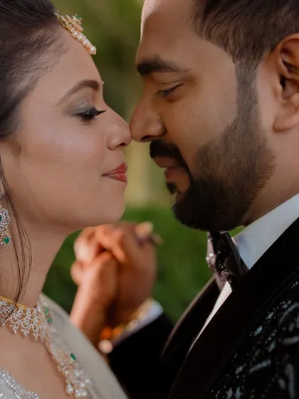 An intimate close-up of Shreya and Rakshit, capturing the quiet connection between them on their reception night.