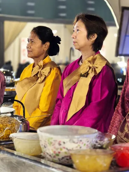 Two of our international chefs, waiting to serve guests. Their presence adds a unique and authentic cultural dimension to our catering services.