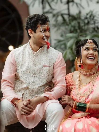 A candid shot of the couple sharing a lighthearted moment. We believe the best photos come from real interactions and genuine laughter.