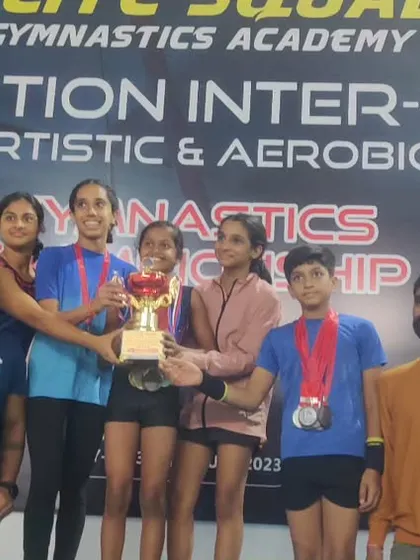 Our team champions with their trophy. This victory is a result of their collective hard work, synchronization, and team spirit.