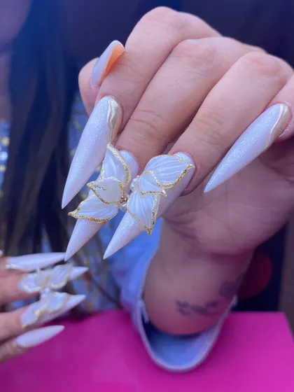 Another view of these stunning 3D butterfly nails, showing how they catch the light. Each butterfly is hand-sculpted, making every set a one-of-a-kind piece of art for your wedding.
