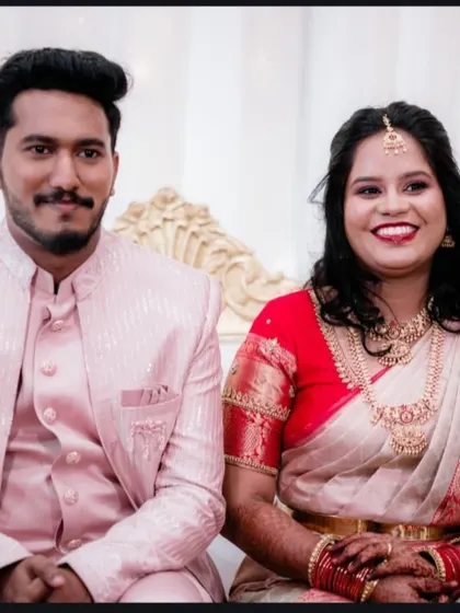 A classic seated portrait of the couple at their reception. This is a great way to get a formal photo that showcases your beautiful outfits.