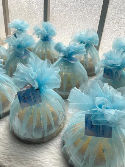 The lemon blueberry tea cakes all wrapped up with blue tulle and custom tags. This is a great example of how I can customize the packaging for your event.