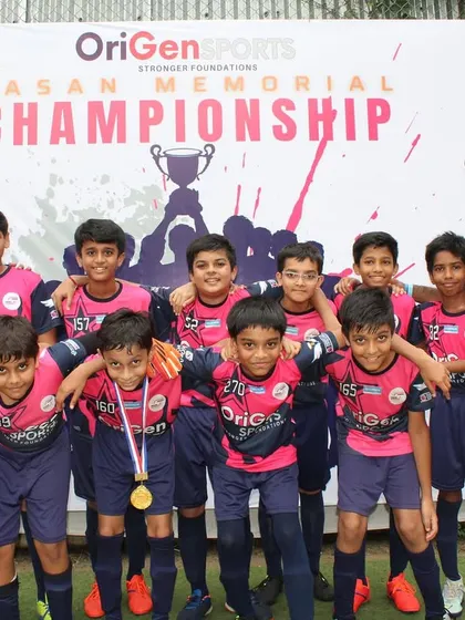 Our Under 11 team posing with their coaches at the event.