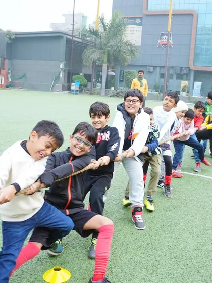 More tug-of-war action! This classic game is always a favorite, promoting teamwork and lots of laughter among the kids.