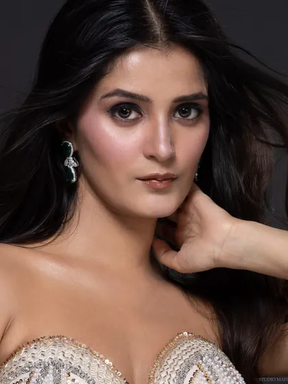 A close-up portrait of the pageant contestant, with a serious and confident expression.