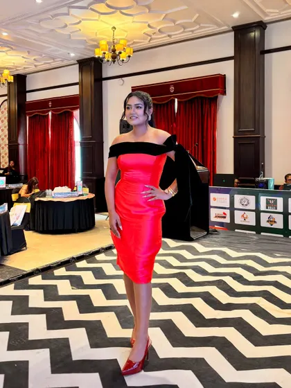 A full-length view of my outfit and the event space. I always dress to match the theme and energy of the party.