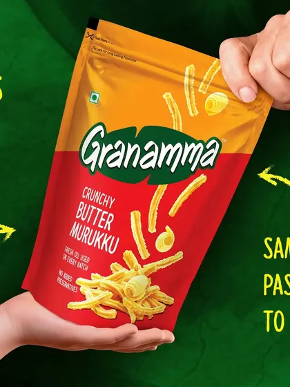 This shot for Granamma's Butter Murukku focuses on the product being shared between two hands. It reinforces the brand's story of recipes passed down through generations, making it feel personal and authentic.
