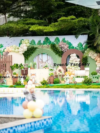 Advaith's woodland theme set up by a beautiful pool. This image shows how I can adapt my magical setups to unique venues, creating a stunning visual contrast between the rustic woods and the sparkling water.
