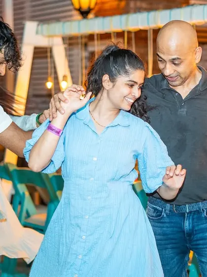 Three people sharing a dance and a laugh. It’s a testament to the friendly and inclusive nature of our community.
