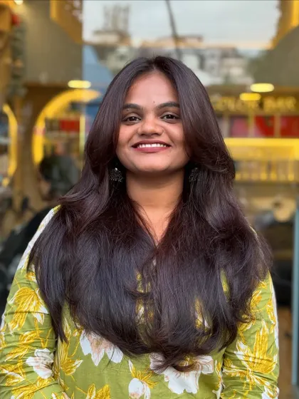 The smile says it all. A great layered haircut not only looks good but also makes you feel fantastic and confident.