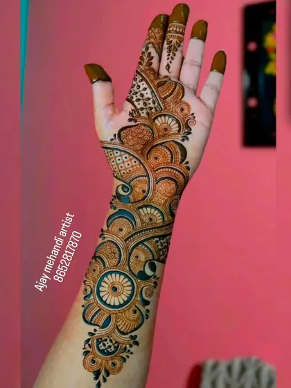 A modern twist on the Arabic style. This design uses bold lines and shaded floral and circular elements to create a striking look on the hand and arm.