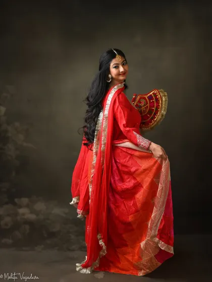 A traditional Punjabi look for an actor's portfolio. The vibrant red Phulkari outfit and classic accessories create a culturally rich and expressive character, perfect for period roles or traditional stories.