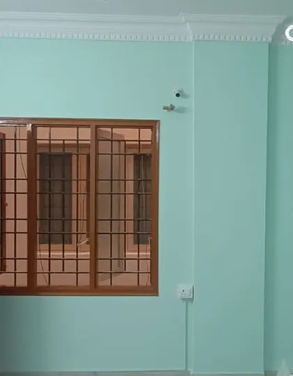 This room was painted in a refreshing light mint green, creating a calm and airy atmosphere. We ensure even coverage and clean edges, even around complex window frames and door trims, for a professional result.