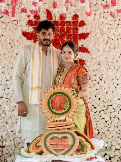 The happy couple at their baby shower celebration. Her makeup is photogenic and designed to look great in all her treasured family photos.