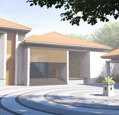 The entrance driveway to a bungalow designed with vernacular charm and contemporary balance. The circular patterned driveway and covered porch create a welcoming and sophisticated arrival experience.