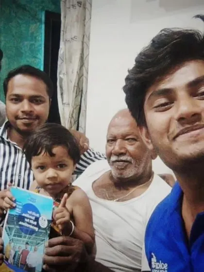 A family with a young child holding our "Built for Generations" booklet. We are committed to providing long-lasting solar solutions.