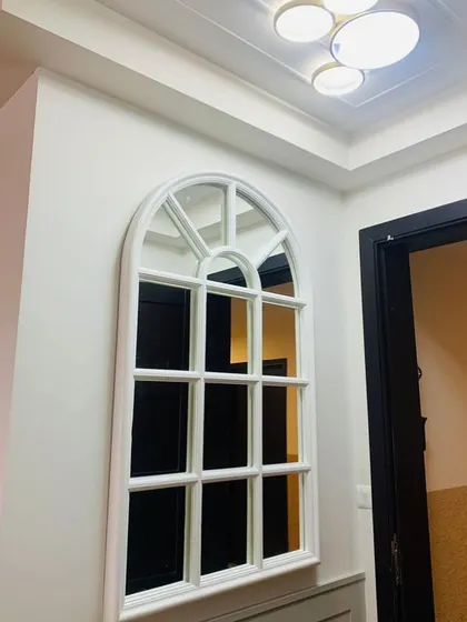 When you can’t decide between a mirror and a window, so you choose both. A beautiful arched window-pane mirror that adds light and character.