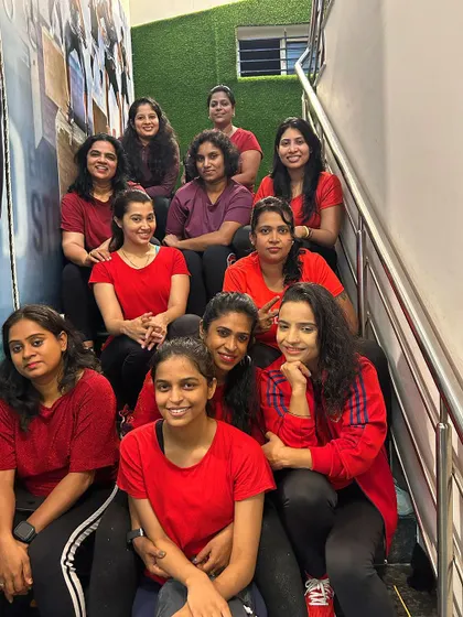 A quick break on the stairs for our Zumba crew. This photo captures the friendship and community spirit among our members, all brought together by a shared love for dance fitness.