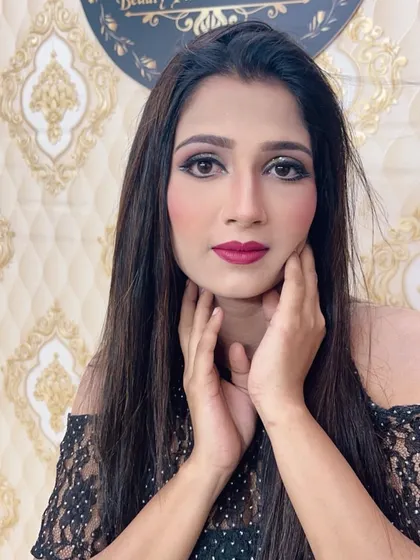 A front-facing portrait of the client, looking glamorous and ready for her event.