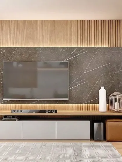 A detailed view of the TV unit, highlighting the texture of the vertical wood slats against the smooth marble-finish panel.