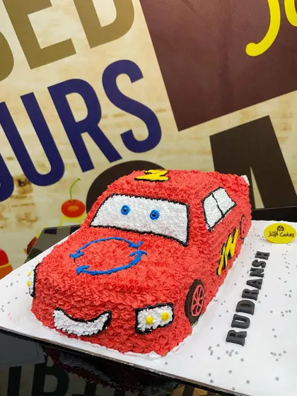 A 3kg sculpted cake of Lightning McQueen from 'Cars', with a unique textured frosting.