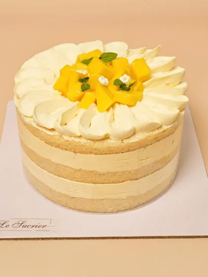 The full Mango Coconut cake, a tropical dream that perfectly balances the sweetness of mango with the creaminess of coconut.