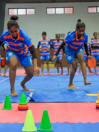 Young hockey players participate in agility games. These activities are not just fun; they also help develop important physical skills in a playful manner.
