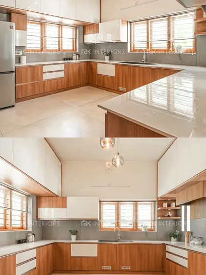 A beautiful kitchen that combines the warmth of wood with the freshness of white. The U-shaped layout provides ample workspace, and the large windows bring in plenty of natural light.