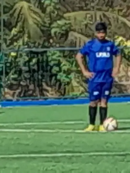 A player preparing to take a set-piece during a tournament match. These are the moments where focus and technique matter most.