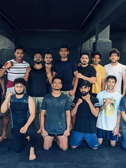 The fight team posing after a session. This is the core of our wolfpack, always ready.