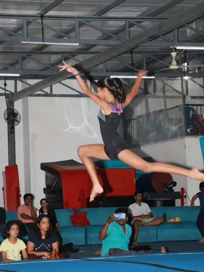 The power and grace of gymnastics captured in a single moment. We train our students in dynamic movements like this split leap, focusing on flexibility, form, and explosive strength.
