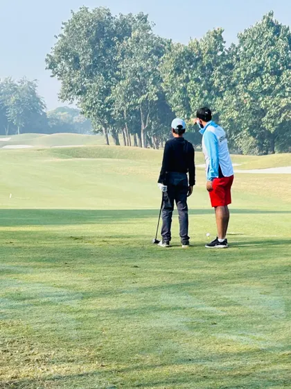 Discussing strategy on the green during the USKIDS Tour Championship. Course management is just as important as swing mechanics.