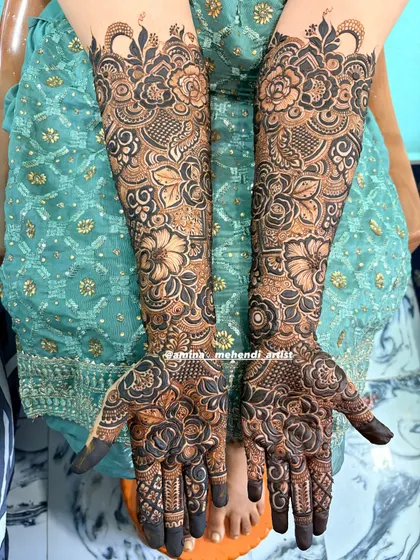 This is an example of my signature full-arm floral mehendi. I love creating dense, intricate patterns with elements like roses, paisleys, and detailed fillers to give you a rich and traditional look for any celebration.