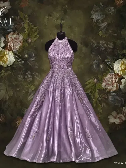 Step into enchantment with this voluminous lavender organza gown, adorned with a fusion of beauty and grace.