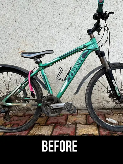 The 'before' state of the green Trek, showing the dirt and wear it arrived with. We see this as a blank canvas for our restoration work.