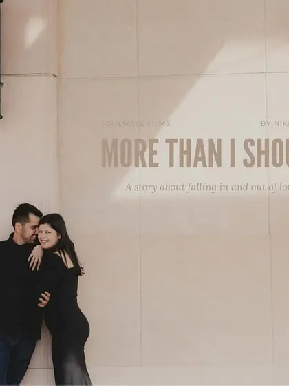 A pre-wedding photo styled like a movie poster with the title "More Than I Should." This creative approach turns their love story into a piece of cinematic art, reflecting my storytelling style.
