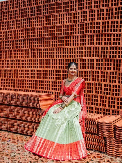 My beautiful client Chethana looks stunning in this custom Kanchi Pattu tissue lehenga. The sea-green and red combination is a classic, and I designed it as a Langa Voni for a traditional yet fresh look for her special day.