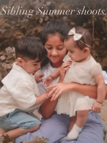 A beautiful interaction between three siblings during a summer photoshoot. These unposed moments often make for the most cherished family portraits.