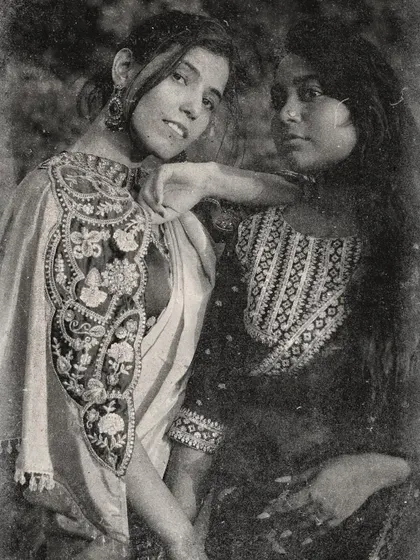A posed black and white photo with a friend, styled to look like a vintage portrait of two princesses.