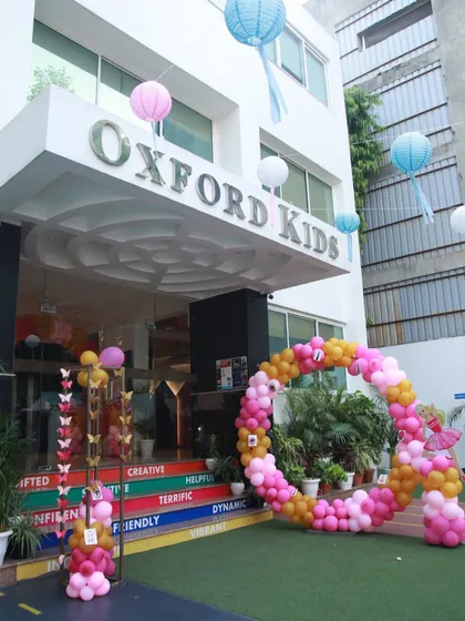 The entrance to our Oxford Kids venue decorated for a Barbie party. The circular balloon arch and hanging lanterns create a festive and inviting atmosphere.