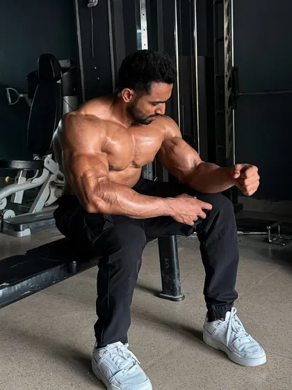 Current update. A relaxed pose on a bench, but the muscles are still popping.
