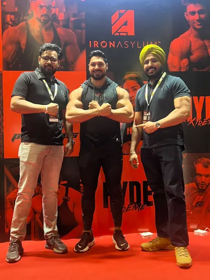 At an expo with fellow fitness enthusiasts. These events are the best place to meet, learn, and grow together as a community.