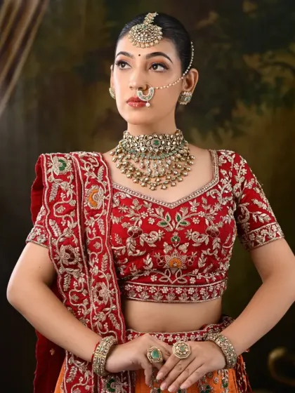 A three-quarter view of the model, showcasing the complete lehenga and dupatta styling.