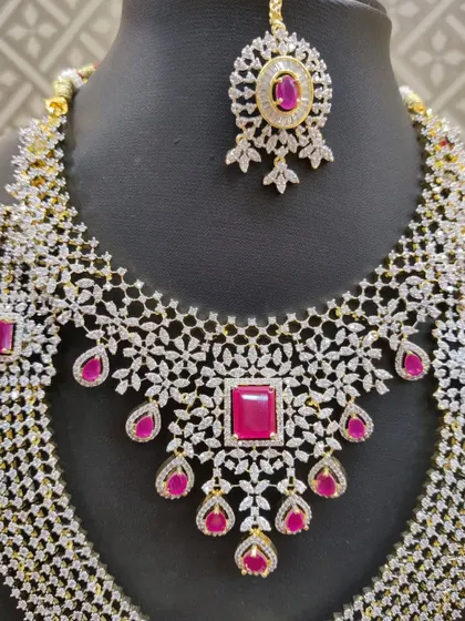 Another detailed shot of the ruby and diamond-look necklace, focusing on the maang tikka.