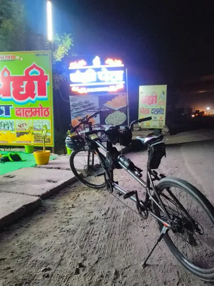 The tandem bike parked at a night stop. This machine carried two riders across four states for 36 hours.