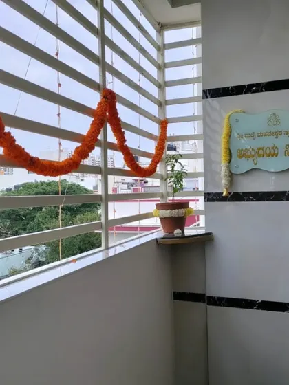 Minimalist decor for a balcony, using a single marigold garland. Sometimes, less is more.